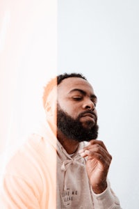 a man with a beard looking at his phone